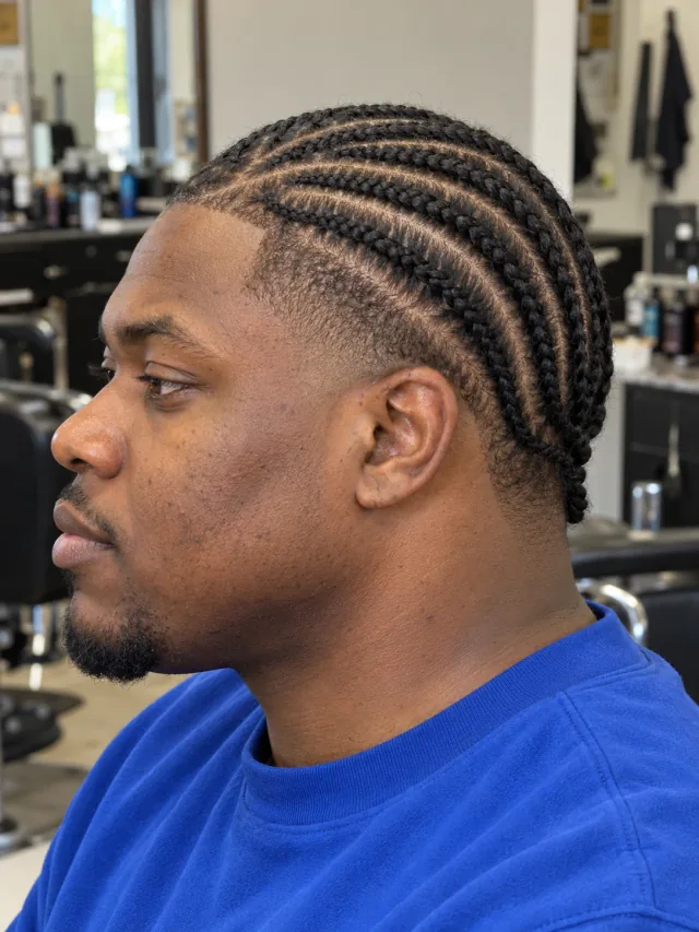 AI haircut concept: mid taper with curved cornrows, left-side angled view.
