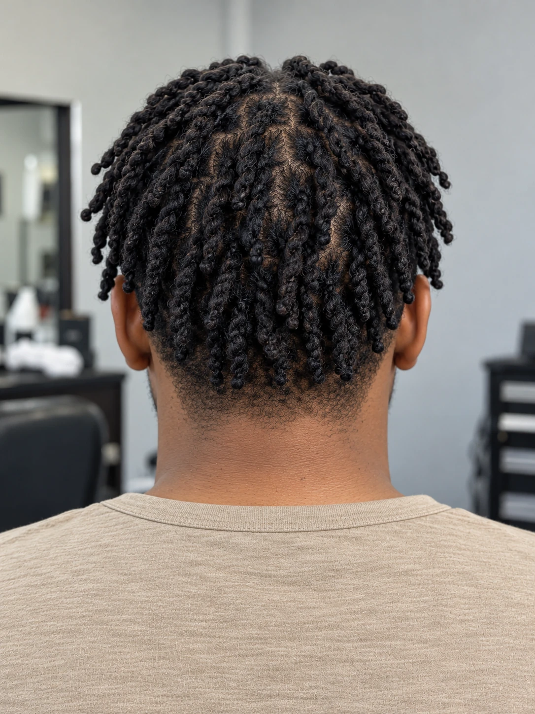AI concept: defined coily twist top with a low taper, rear view.