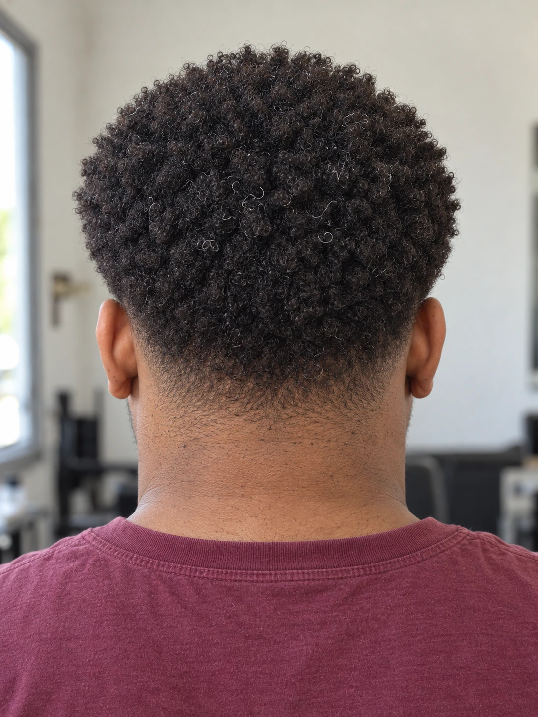 AI concept: rounded coily top with a mid taper, rear view.