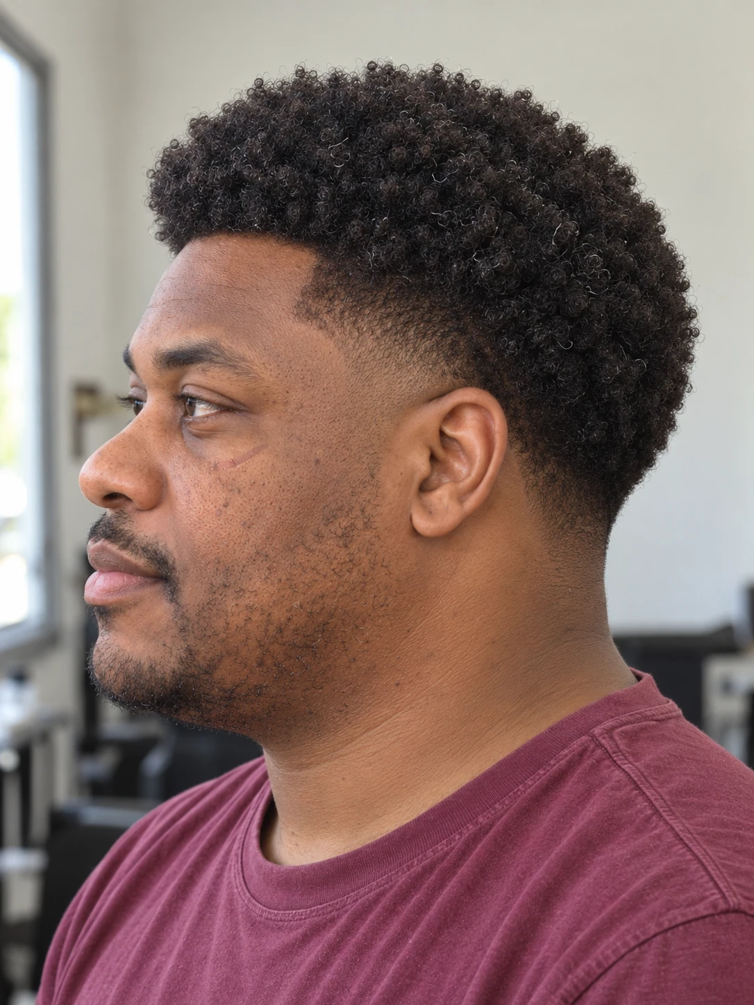 AI concept: rounded coily top with a mid taper, left-side angled view.