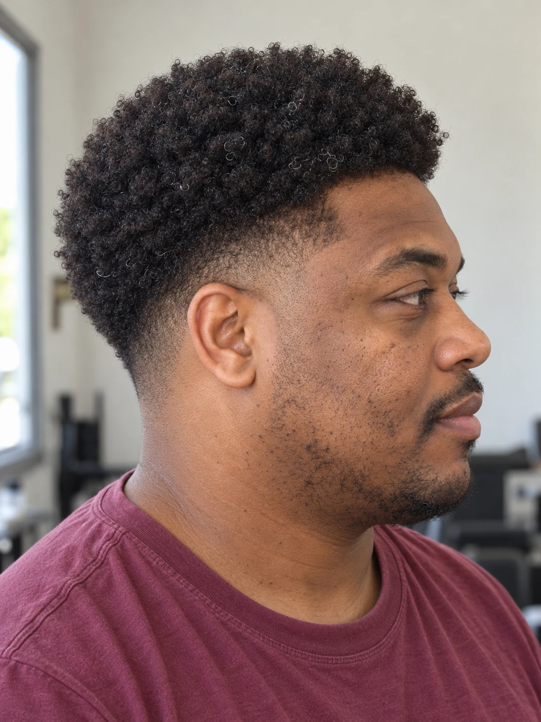 AI concept: rounded coily top with a mid taper, right-side angled view.