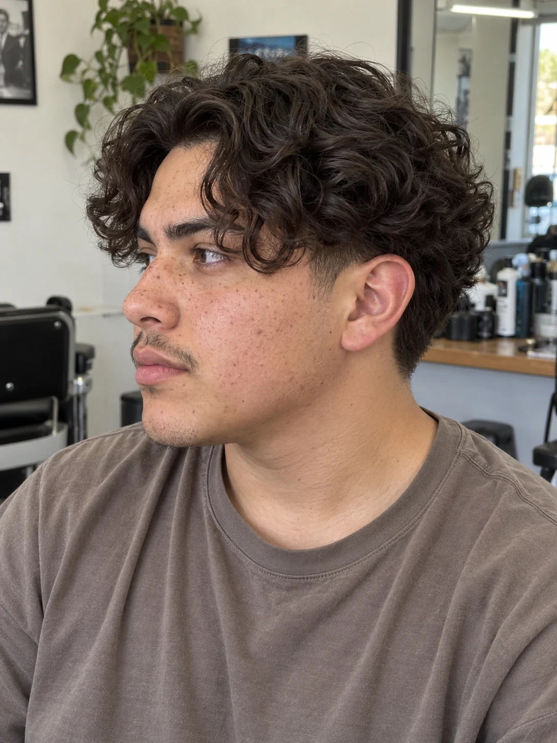 AI haircut concept: low taper with curly curtains, left-side angled view.