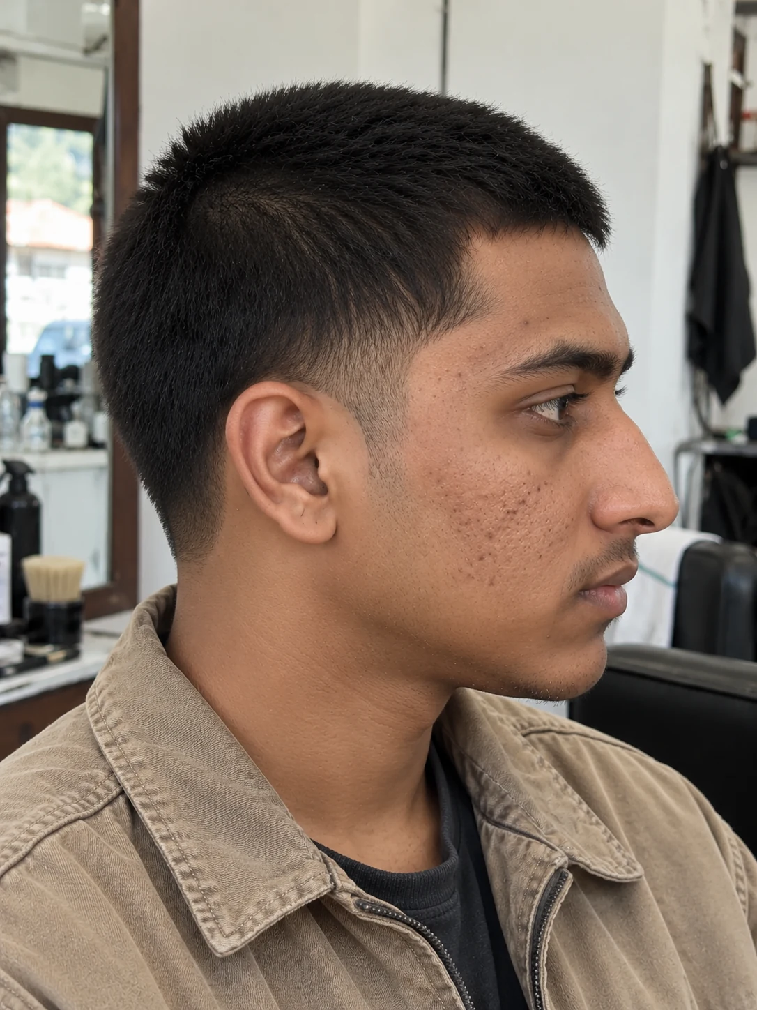 AI haircut concept: low taper with a compact butch cut, opposite-side view.