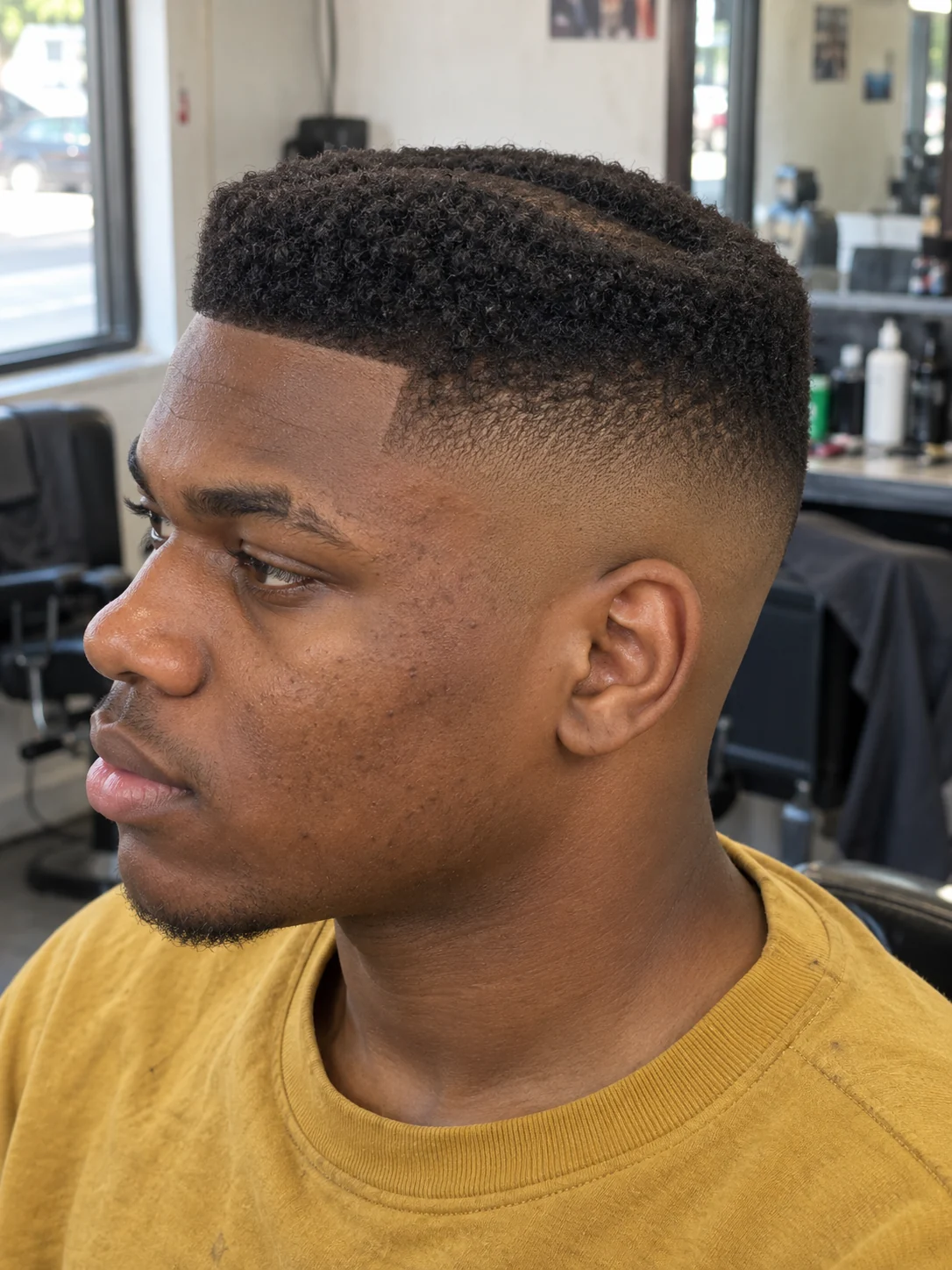 AI concept: high skin fade with a recessed-centre flat top, left-side angled view.